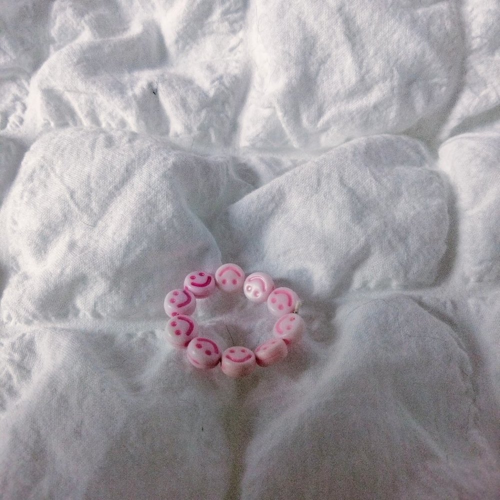 Pink smiley face ring